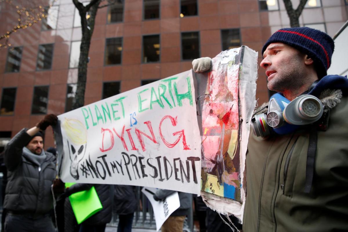 Demonstrators protest Donald Trump's climate change stance outside the office of U.S. Senator Charles Schumer (D-NY) in New York, January 9. REUTERS.