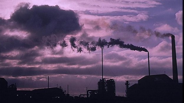 A photo of smokestacks. The IPCC says fossil fuels without carbon capture should be "phased out" by 2100