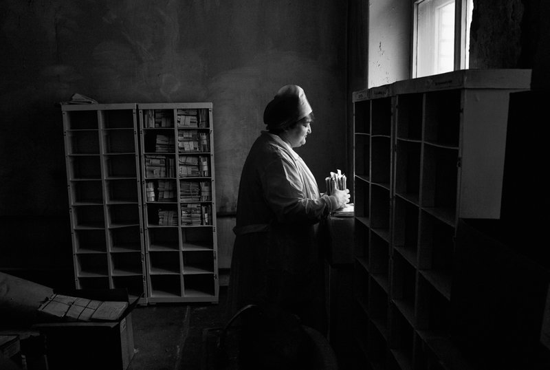 A nurse organizes the files of deceased patients at a TB hospital in Togliatti, Russia. Multi-drug-resistant tuberculosis is a huge problem in the former Soviet Union. Misha Friedman